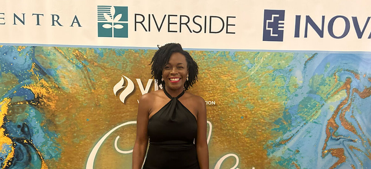 Set to carry the nursing banner at commencement, Charity Brown highlights the power of personalized, purpose-driven online education.