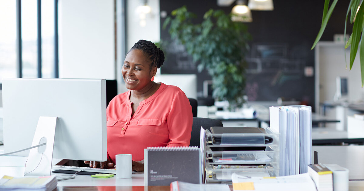 Woman working at desk in an open office