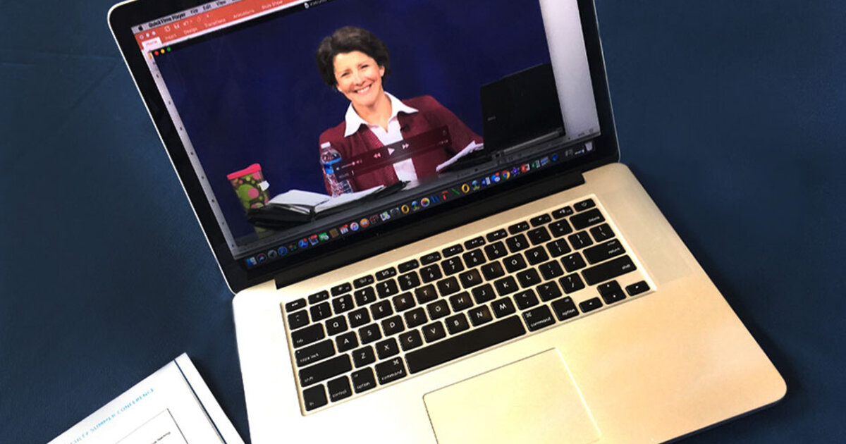 Professor on an laptop giving a lecture