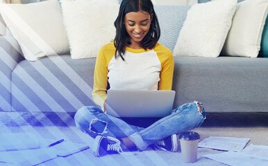 Woman attending classes online on a laptop