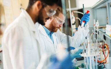 Two men conducting research in a lab setting