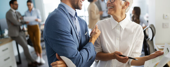 Group of corporate professionals engaging in conversation