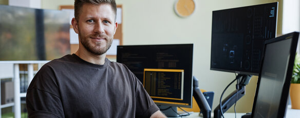 Adult male student sitting at a computer