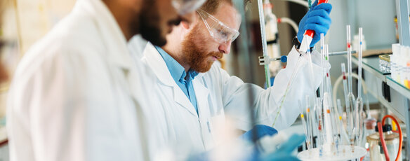 Two men conducting research in a lab setting