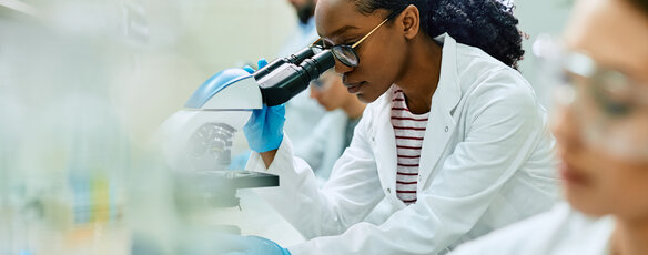 Woman conducting research in a lab setting