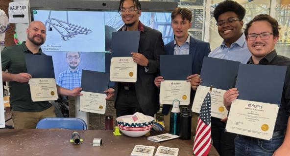 Jordan Dunn and Jacob Leonard, the two students on the left, have worked on an engineering project to help a wounded veteran.