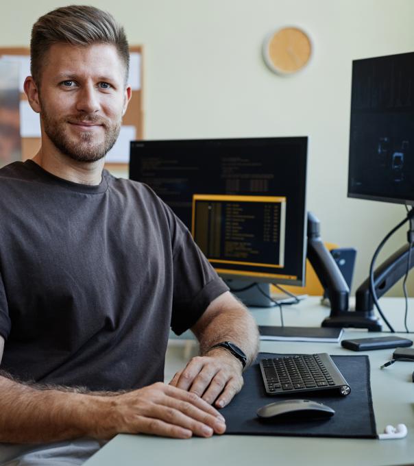 Adult male student sitting at a computer