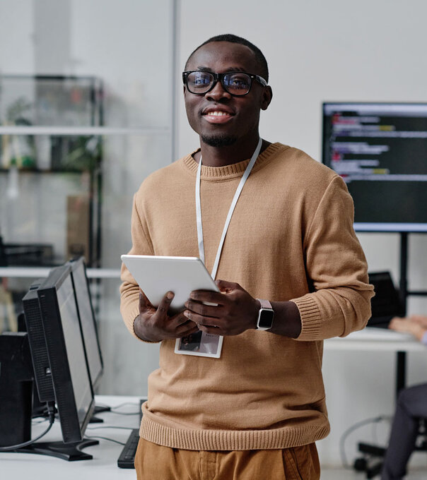 IT specialist working online on digital tablet