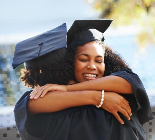 Two African American adults hug joyfully, wearing graduation caps and gowns 