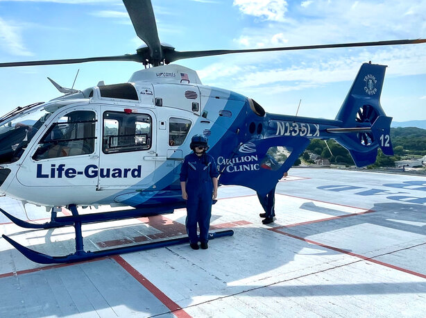 Baylee Slagle stands in front of a Life-Guard air ambulance after shadowing the crew for a day, an experience that inspired her goal of becoming a flight nurse.