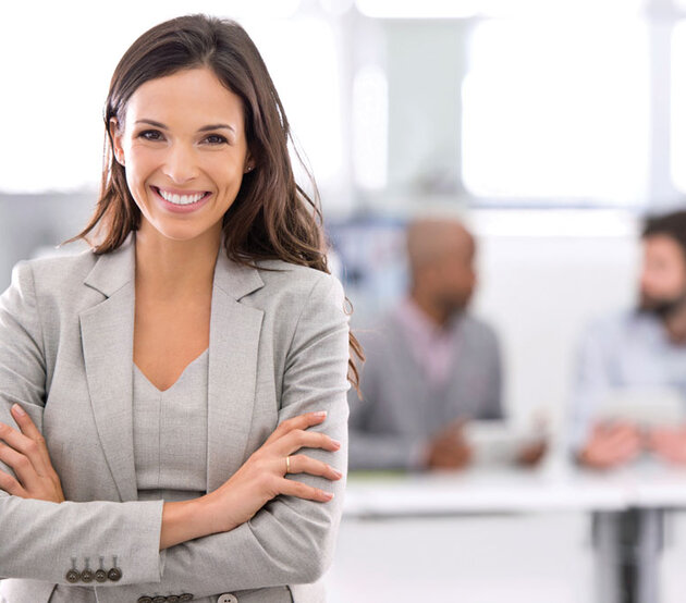 Smiling woman demonstrating leadership in a meeting