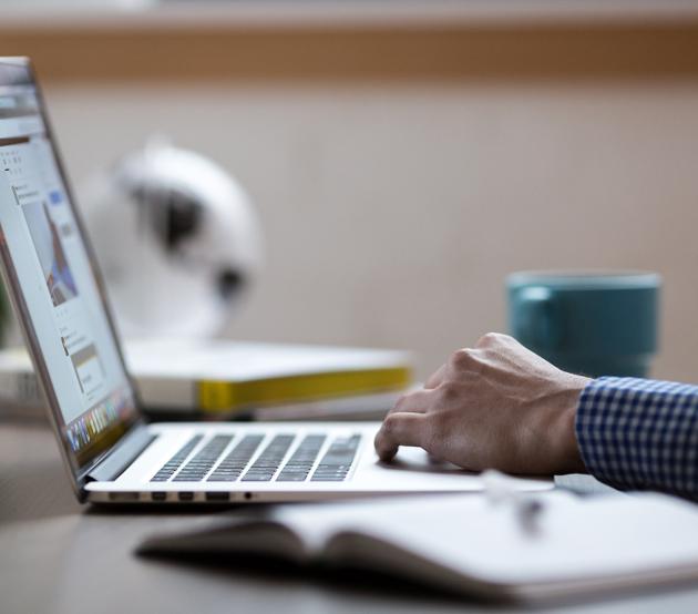 hand and laptop