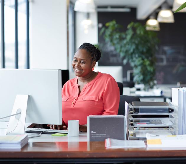 Woman working at desk in an open office