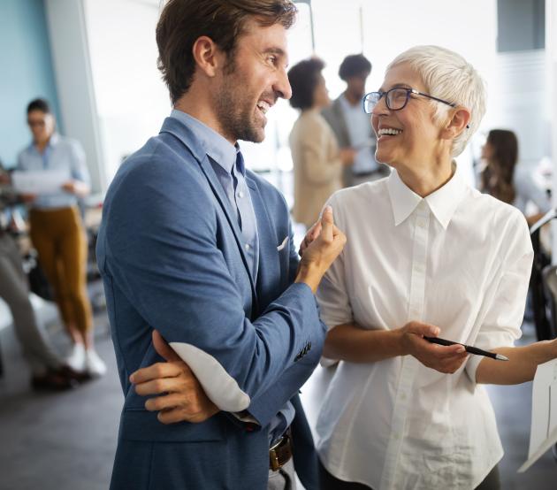 Group of corporate professionals engaging in conversation