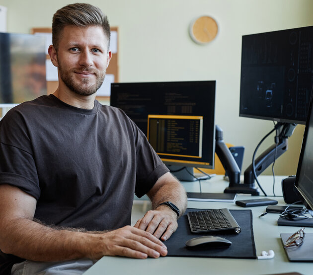 Adult male student sitting at a computer