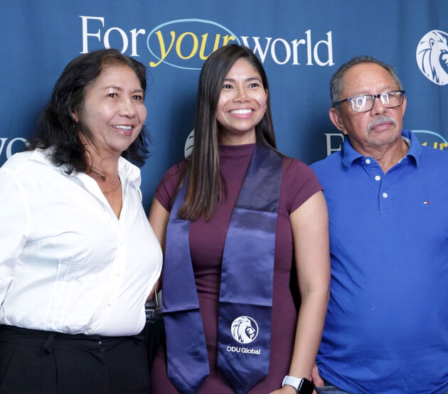 An ODU student celebrates with family before commencement.