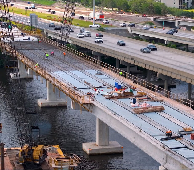 Civil engineers work on-site during a major bridge construction project.