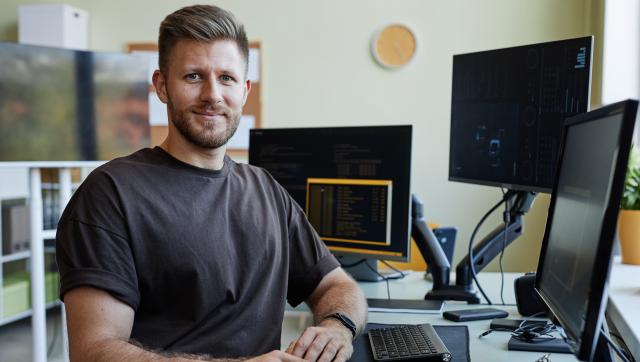 Adult male student sitting at a computer