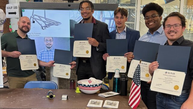 Jordan Dunn and Jacob Leonard, the two students on the left, have worked on an engineering project to help a wounded veteran.