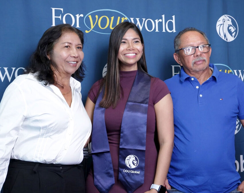 An ODU student celebrates with family before commencement.