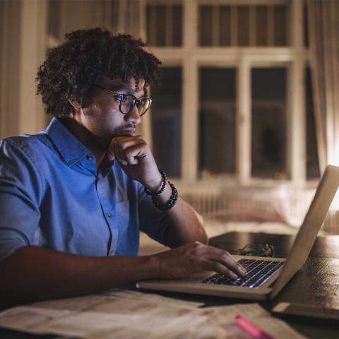 Young man focused on computer