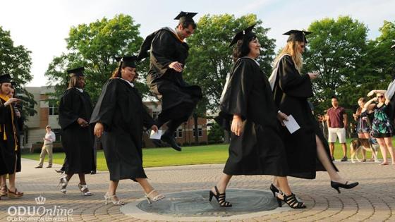 ODU graduates crossing the seal on Kaufman Mall