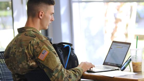 Military student on computer