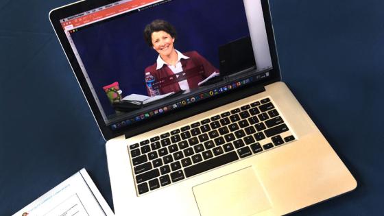Professor on an laptop giving a lecture