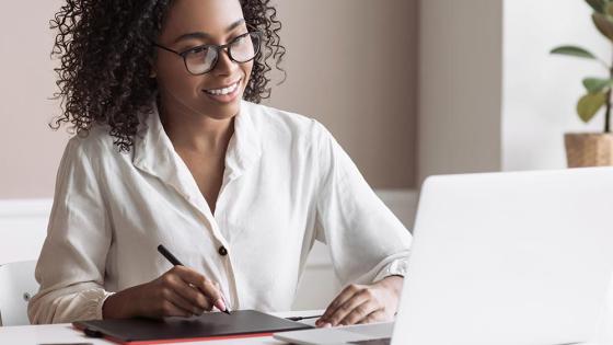 Woman taking an online class on a lapto