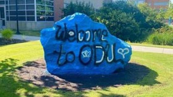 A boulder on ODU's main campus with a blue paint scheme and the message "Welcome to ODU!"