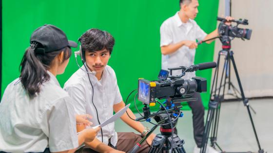 A camera crew setting up a studio