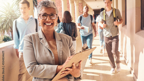 Woman standing in a hallway smiling