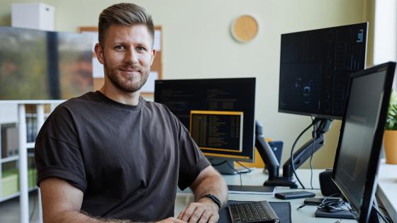 Adult male student sitting at a computer