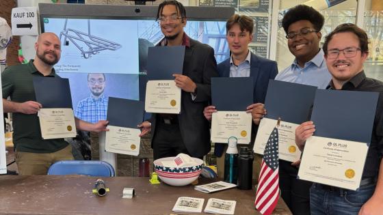 Jordan Dunn and Jacob Leonard, the two students on the left, have worked on an engineering project to help a wounded veteran.