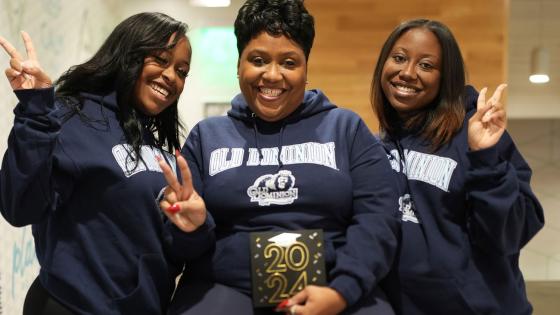 ODU alumnae Jordyn Harrell, left, and Jasmyn Harrell flank their mother Celeste Harrell, who is scheduled to graduate from ODU in May 2023.