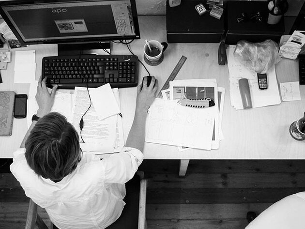 Overhead view of professional at desk with computer