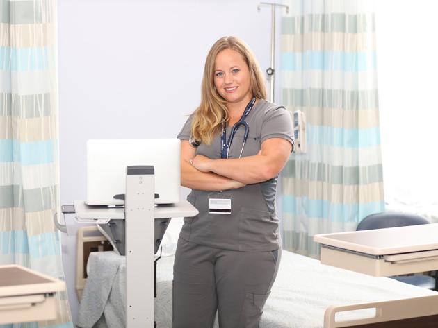 Nurse stands in clinic environment