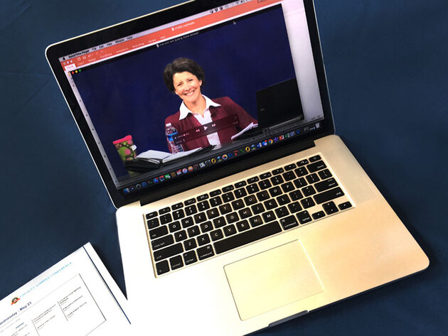 Professor on an laptop giving a lecture