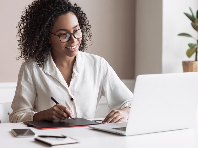 Woman taking an online class on a lapto