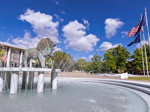 View of Old Dominion University's Monarch Fountain, containing a bronze lion statue, on Kaufman Mall.
