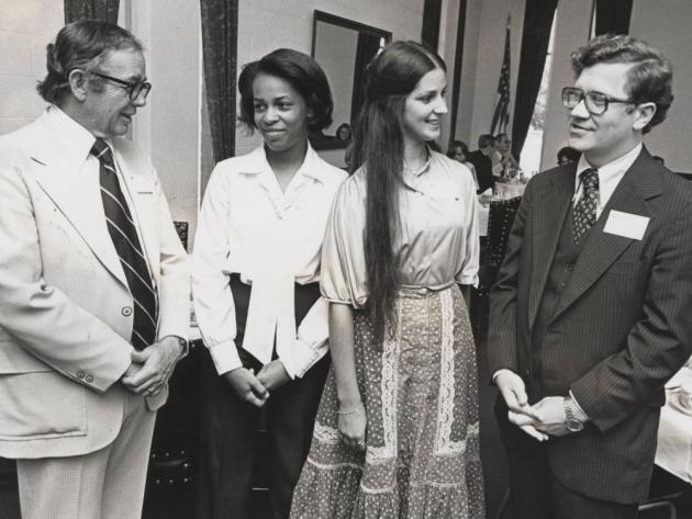 Merit scholars who are alumni gather at an university function. President Alfred B. Rollins, Jr. is pictured at the left.