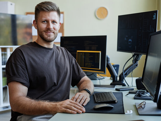 Adult male student sitting at a computer
