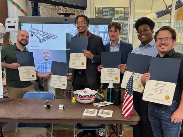 Jordan Dunn and Jacob Leonard, the two students on the left, have worked on an engineering project to help a wounded veteran.