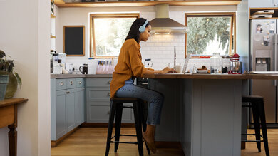 Student looking at laptop on kitchen counter